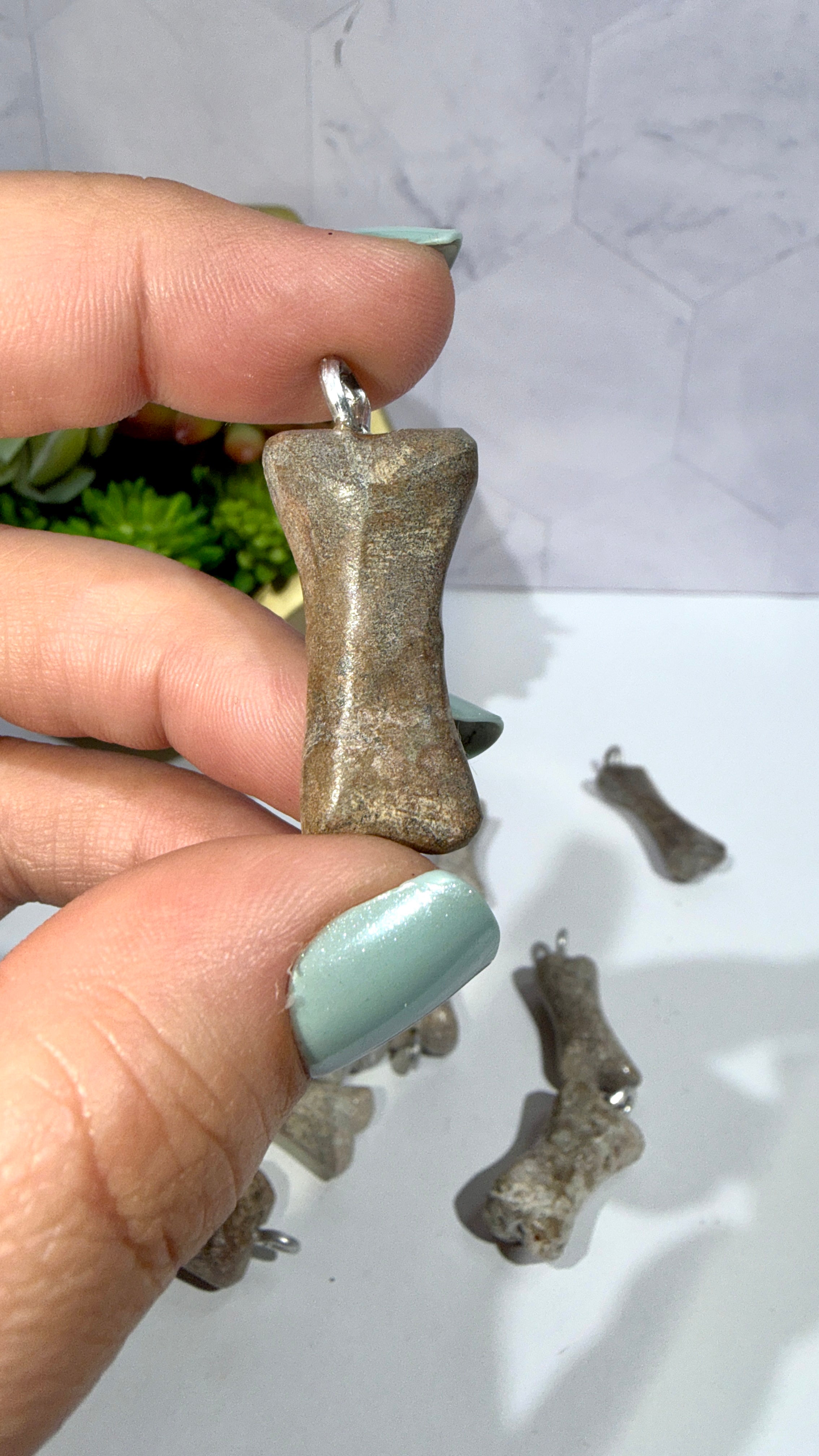 Genuine Dinosaur Bone Pendant "Atlasaurus imelakai"